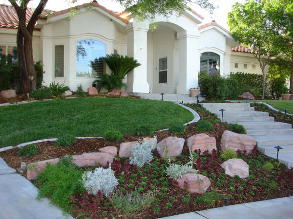 front yard with staircase leading to house